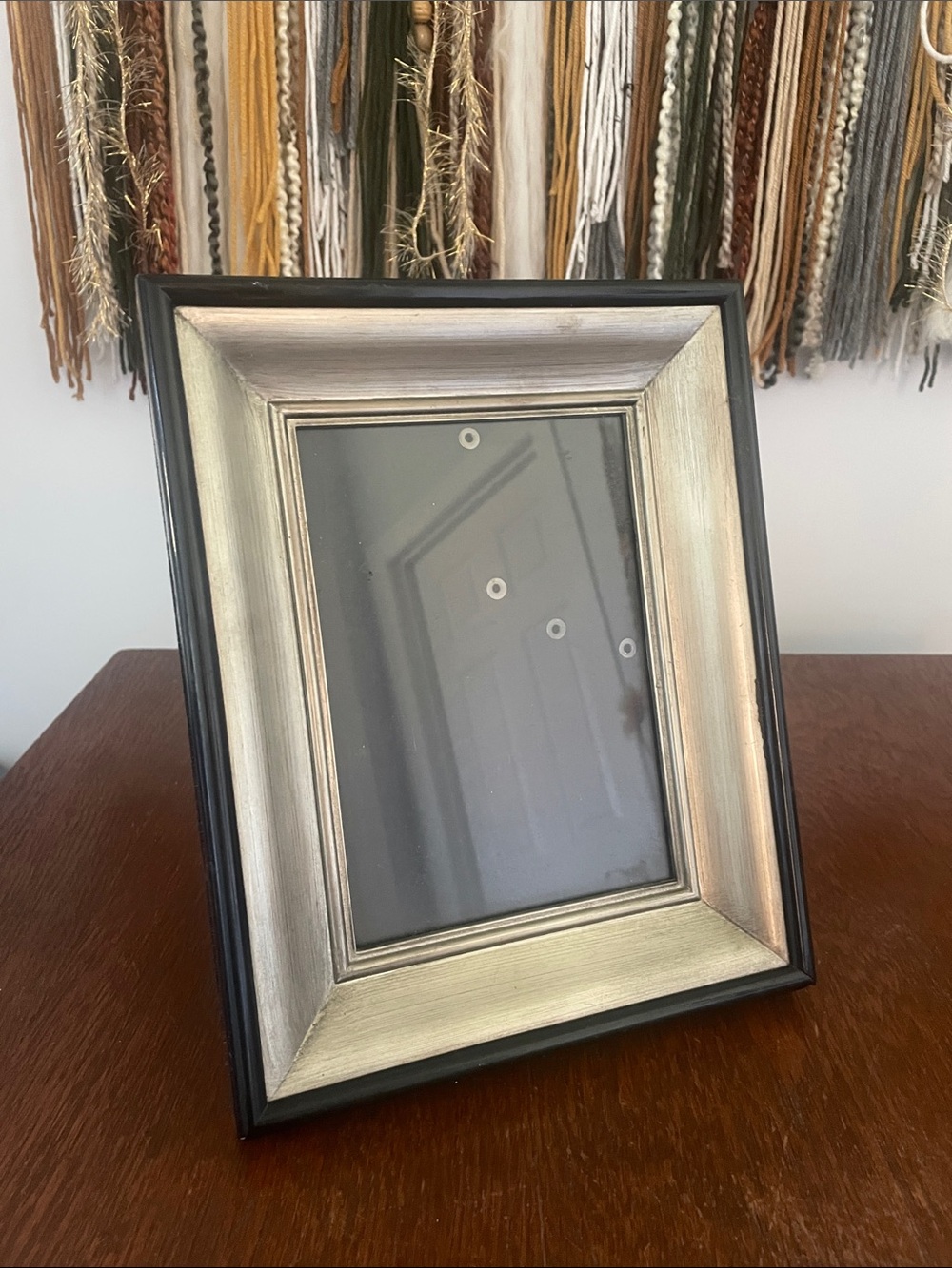 Silver and Black picture frame holds a 5x7 print